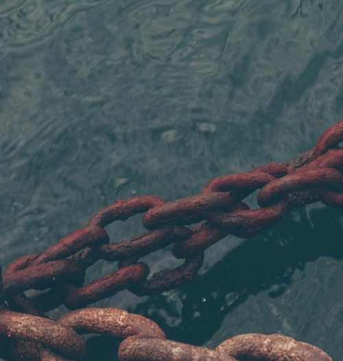 rusty chain on water